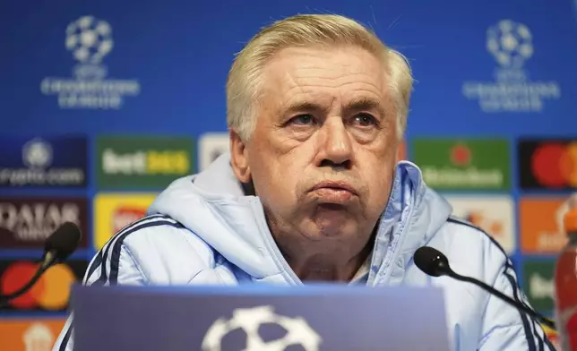 Real Madrid's head coach Carlo Ancelotti attends a press conference in Manchester, England, Monday, Feb. 10, 2025, ahead of the Champions League soccer match between Manchester City and Real Madrid. (Martin Rickett/PA via AP)