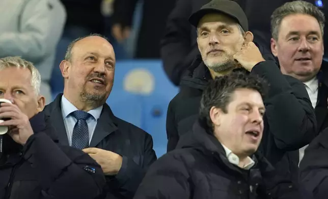 England manager Thomas Tuchel talks to Rafael Benitez before the start of the Champions League playoff first leg soccer match between Manchester City and Real Madrid at the Etihad Stadium in Manchester, England, Tuesday, Feb. 11, 2025. (AP Photo/Dave Thompson)