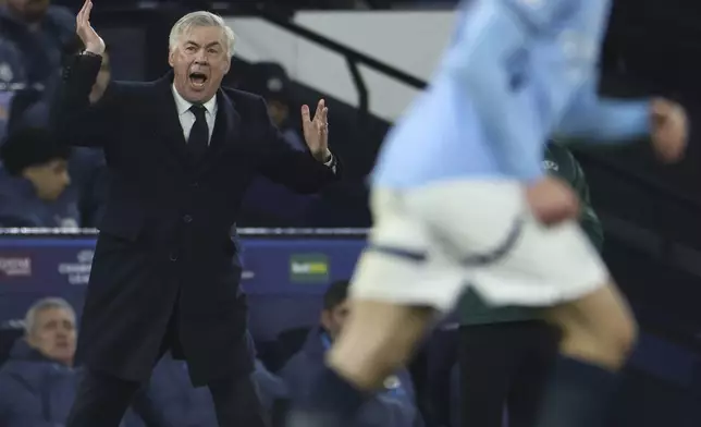 Real Madrid's head coach Carlo Ancelotti shouts from the touchline during the Champions League playoff first leg soccer match between Manchester City and Real Madrid at the Etihad Stadium in Manchester, England, Tuesday, Feb. 11, 2025. (AP Photo/Darren Staples)