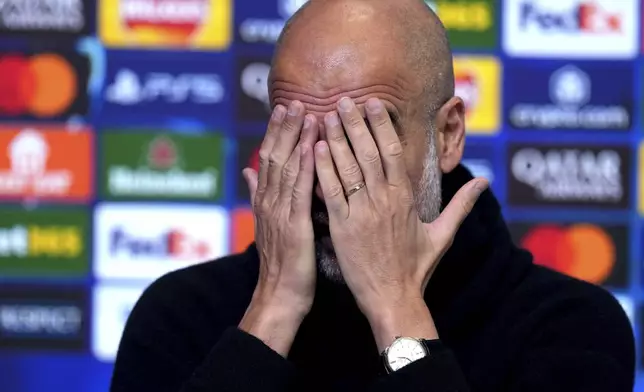 Manchester City manager Pep Guardiola gestures during a press conference at the City Football Academy, Manchester, England, Monday, Feb. 10, 2025. (Martin Rickett/PA via AP)