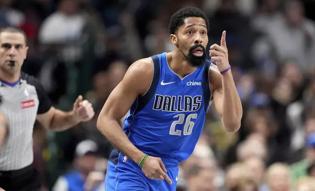 Dallas Mavericks forward P.J. Washington (25) celebrates after sinking a three-point basket in the first half of an NBA basketball game against the Sacramento Kings in Dallas, Monday, Feb. 10, 2025. (AP Photo/Tony Gutierrez)