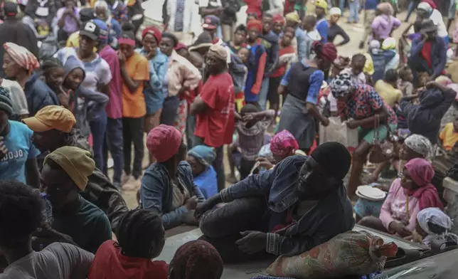 People displaced by armed gang attacks take refuge at the town hall of the Kenscoff neighborhood of Port-au-Prince, Haiti, Monday, Feb. 3, 2025. (AP Photo/Odelyn Joseph)