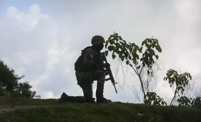 A soldier carries out an anti-gang operation in the Kenscoff neighborhood of Port-au-Prince, Haiti, Monday, Feb. 3, 2025. (AP Photo/Odelyn Joseph)