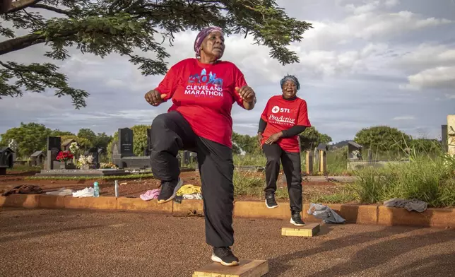 Women exercise with the Commandos Fitness Club at the Warren Hills cemetery in Harare, Zimbabwe, Saturday, Jan. 18, 2025. ( AP Photo/Aaron Ufumeli)