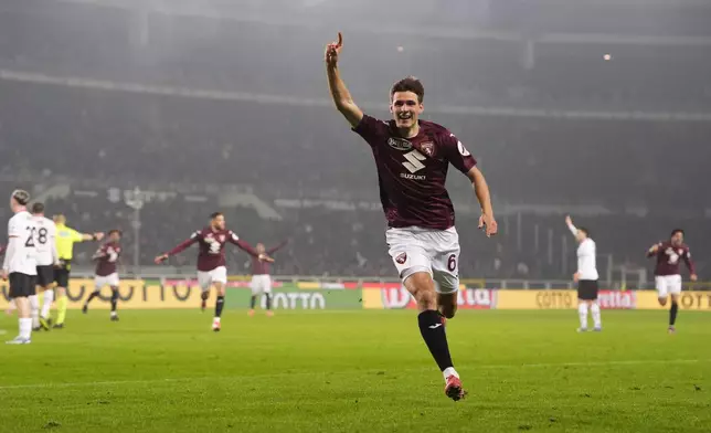 Torino's Gvidas Gineitis celebrates after scoring during the Italian Serie A soccer match between Torino and AC Milan the Stadio Olimpico Grande Torino in Turin, north west Italy, Saturday, Feb. 22, 2025. (Fabio Ferrari/LaPresse via AP)