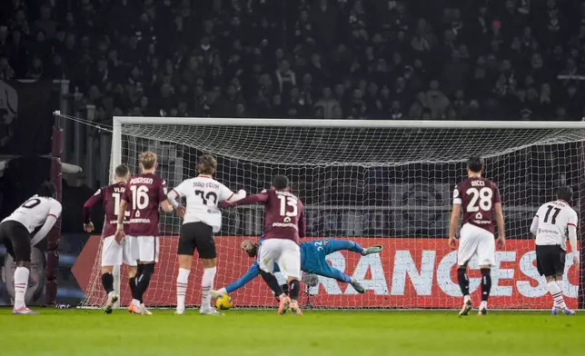 Torino's goalkeeper Vanja Milinkovic-Savic saves a penalty during the Italian Serie A soccer match between Torino and AC Milan the Stadio Olimpico Grande Torino in Turin, north west Italy, Saturday, Feb. 22, 2025. (Fabio Ferrari/LaPresse via AP)