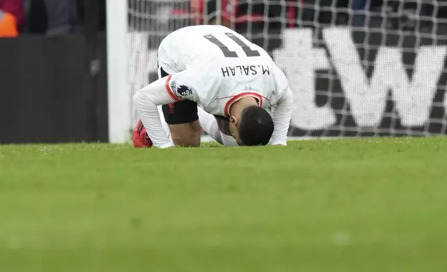 Liverpool's Mohamed Salah reacts after scoring his side's opening goal during the English Premier League soccer match between Bournemouth and Liverpool at the Vitality stadium in Bournemouth, England, Saturday, Feb. 1, 2025. (AP Photo/Alastair Grant)