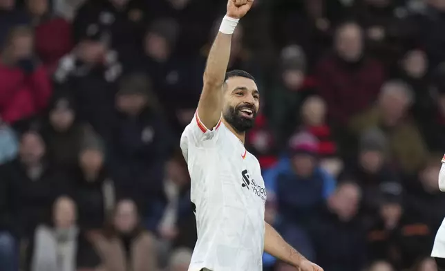 Liverpool's Mohamed Salah celebrates after scoring his side's second goal during the English Premier League soccer match between Bournemouth and Liverpool at the Vitality stadium in Bournemouth, England, Saturday, Feb. 1, 2025. (AP Photo/Alastair Grant)