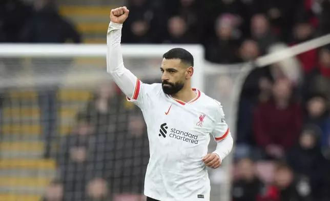 Liverpool's Mohamed Salah celebrates after scoring his side's opening goal during the English Premier League soccer match between Bournemouth and Liverpool at the Vitality stadium in Bournemouth, England, Saturday, Feb. 1, 2025. (AP Photo/Alastair Grant)