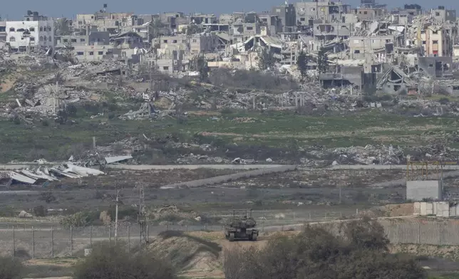 An Israeli tank takes a position near the border with Gaza in southern Israel, Sunday, Feb. 9, 2025. (AP Photo/Ohad Zwigenberg)