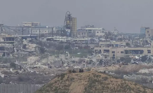 Israeli soldiers take positions near the border with Gaza in southern Israel, Sunday, Feb. 9, 2025. (AP Photo/Ohad Zwigenberg)