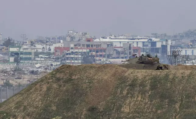 An Israeli tank near the border with Gaza in southern Israel, Sunday, Feb. 9, 2025. (AP Photo/Ohad Zwigenberg)