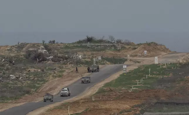 Israeli soldiers inside the northern Gaza Strip as seen from southern Israel, Sunday, Feb. 9, 2025. (AP Photo/Ohad Zwigenberg)