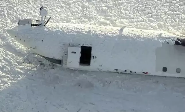This image taken from video provided by CTV shows an aerial view of the overturned plane at Toronto Pearson Airport, Tuesday, Feb. 18, 2025. (CTV via AP)