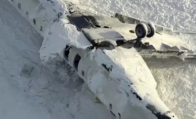 This image taken from video provided by CTV shows an aerial view of the overturned plane at Toronto Pearson Airport, Tuesday, Feb. 18, 2025. (CTV via AP)