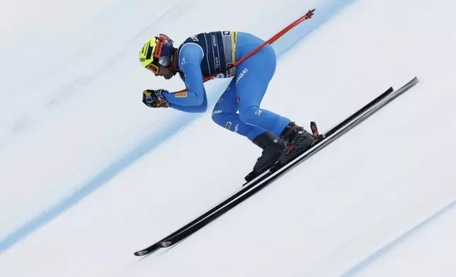 Italy's Christof Innerhofer competes in a downhill run of a men's team combined event, at the Alpine Ski World Championships, in Saalbach-Hinterglemm, Austria, Wednesday, Feb. 12, 2025. (AP Photo/Gabriele Facciotti)