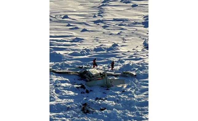 This photo provided by the U.S. Coast Guard on Friday, Feb. 7, 2025, shows a small commuter plane that crashed in western Alaska on a flight that was bound for the hub community of Nome. (U.S. Coast Guard via AP)