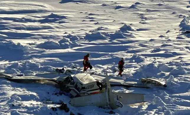 This photo provided by the U.S. Coast Guard on Friday, Feb. 7, 2025, shows a small commuter plane that crashed in western Alaska on a flight that was bound for the hub community of Nome. (U.S. Coast Guard via AP)