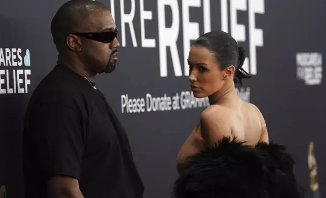 Kanye West, left, and Bianca Censori arrive at the 67th annual Grammy Awards on Sunday, Feb. 2, 2025, in Los Angeles. (Photo by Jordan Strauss/Invision/AP)