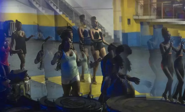 Transgender women take a samba class at the Paraiso de Tuiuti samba school ahead of the Carnival parade in Rio Janeiro, Wednesday, Feb. 5, 2025. (AP Photo/Silvia Izquierdo)