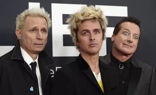 Mike Dirnt, from left, Billie Joe Armstrong, and Tre Cool of 'Green Day' arrive at the 67th annual Grammy Awards on Sunday, Feb. 2, 2025, in Los Angeles. (Photo by Jordan Strauss/Invision/AP)