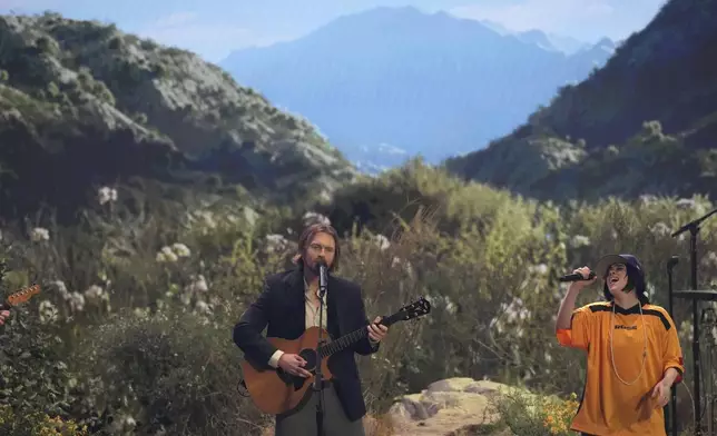 Finneas O'Connell, left, and Billie Eilish perform "Birds of a Feather" during the 67th annual Grammy Awards on Sunday, Feb. 2, 2025, in Los Angeles. (AP Photo/Chris Pizzello)