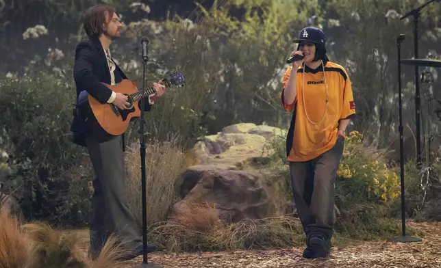 Finneas O'Connell, left, and Billie Eilish perform "Birds of a Feather" during the 67th annual Grammy Awards on Sunday, Feb. 2, 2025, in Los Angeles. (AP Photo/Chris Pizzello)