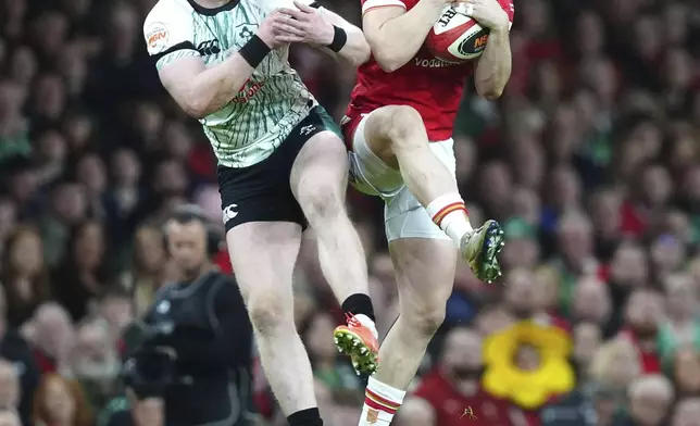Wales' Tom Rogers catches a high ball during the Six Nations rugby match between Wales and Ireland, at the Principality Stadium, in Cardiff, Wales, Saturday, Feb. 22, 2025. (David Davies/PA via AP)