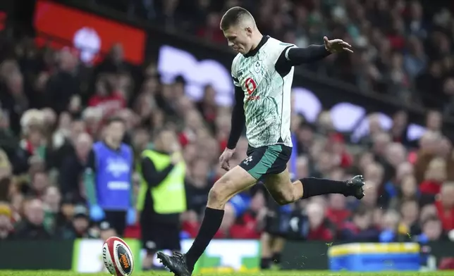 Ireland's Sam Prendergast scores a penalty, during the Six Nations rugby match between Wales and Ireland, at the Principality Stadium, in Cardiff, Wales, Saturday, Feb. 22, 2025. (David Davies/PA via AP)