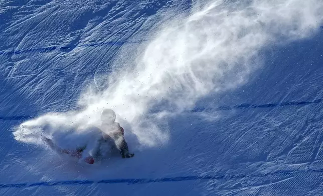 Xiong Shirui of China crashes during the Women's Snowboard Big Air at the 9th Asian Winter Games in Yabuli in northeast China's Heilongjiang province on Monday, Feb. 10, 2025. (AP Photo/Andy Wong)