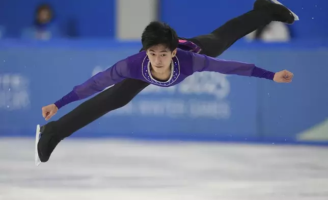 North Korea's Ro Yong Myong performs during the men's single skating short program in figure skating at the 9th Asian Winter Games in Harbin, China on Tuesday, Feb. 11, 2025. (AP Photo/Aaron Favila)
