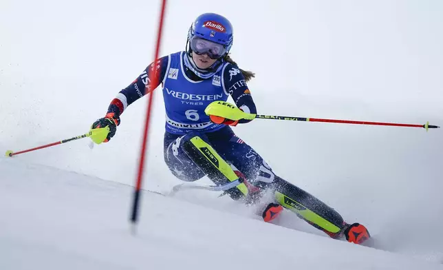 United States' Mikaela Shiffrin speeds down the course during a women's World Cup slalom, in Courchevel, France, Thursday Jan. 30, 2025. (AP Photo/Gabriele Facciotti)