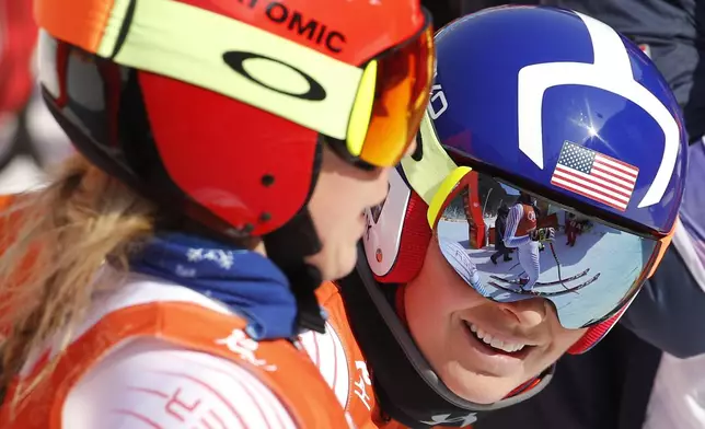 FILE - United States' Lindsey Vonn, right, chats with United States' Mikaela Shiffrin after women's downhill training at the 2018 Winter Olympics in Jeongseon, South Korea, Feb. 20, 2018. (AP Photo/Cristophe Ena, File)