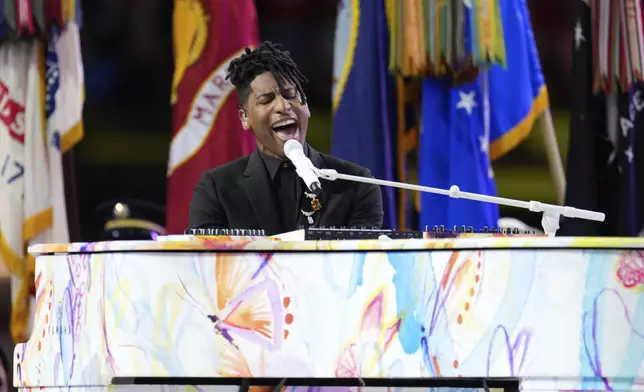 Jon Batiste performs the national anthem before the NFL Super Bowl 59 football game between the Kansas City Chiefs and the Philadelphia Eagles, Sunday, Feb. 9, 2025, in New Orleans. (AP Photo/George Walker IV)