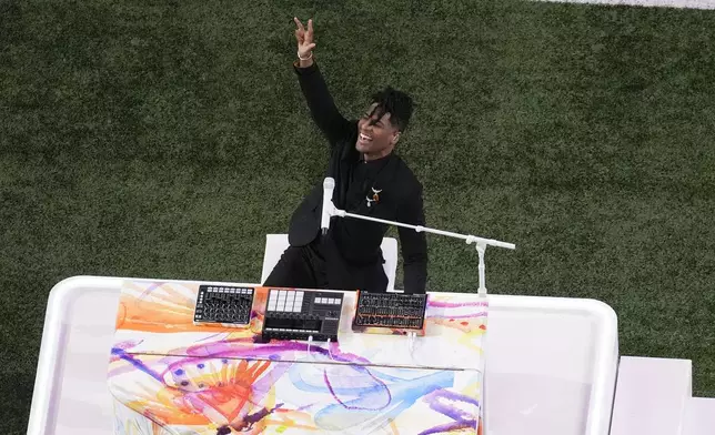 Jon Batiste performs the national anthem before the NFL Super Bowl 59 football game between the Kansas City Chiefs and the Philadelphia Eagles, Sunday, Feb. 9, 2025, in New Orleans. (AP Photo/David J. Phillip)