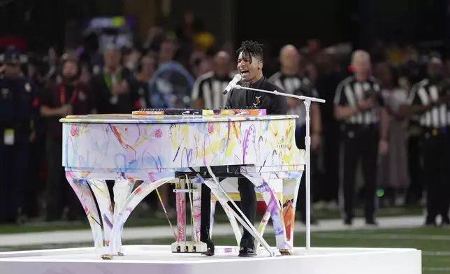 Jon Batiste performs the national anthem before the NFL Super Bowl 59 football game between the Kansas City Chiefs and the Philadelphia Eagles, Sunday, Feb. 9, 2025, in New Orleans. (AP Photo/Stephanie Scarbrough)