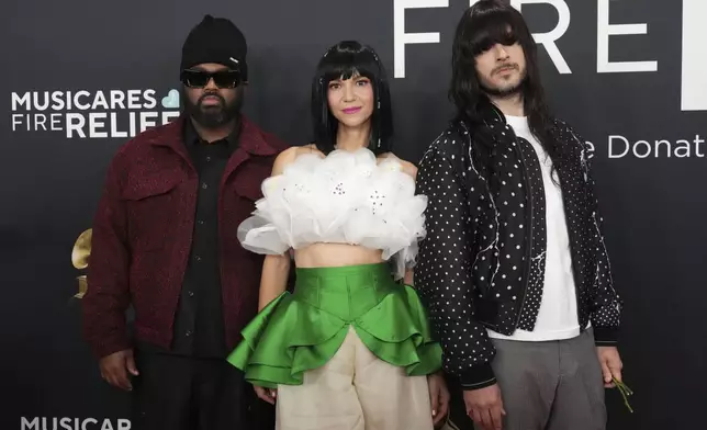 Donald Johnson Jr., from left, Laura Lee, and Mark Speer of 'Khrunangbin' arrive at the 67th annual Grammy Awards on Sunday, Feb. 2, 2025, in Los Angeles. (Photo by Jordan Strauss/Invision/AP)