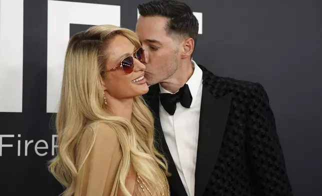 Paris Hilton, left, and Carter Reum arrive at the 67th annual Grammy Awards on Sunday, Feb. 2, 2025, in Los Angeles. (Photo by Jordan Strauss/Invision/AP)