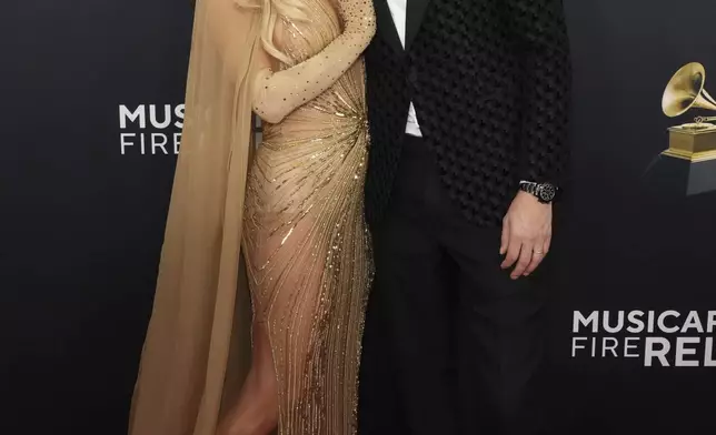 Paris Hilton, left, and Carter Reum arrive at the 67th annual Grammy Awards on Sunday, Feb. 2, 2025, in Los Angeles. (Photo by Jordan Strauss/Invision/AP)