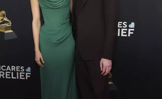 Claudia Sulewski, left, and Finneas arrive at the 67th annual Grammy Awards on Sunday, Feb. 2, 2025, in Los Angeles. (Photo by Jordan Strauss/Invision/AP)