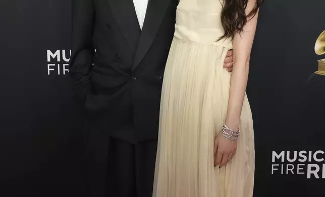 Jack Antonoff, left, and Margaret Qualley arrive at the 67th annual Grammy Awards on Sunday, Feb. 2, 2025, in Los Angeles. (Photo by Jordan Strauss/Invision/AP)