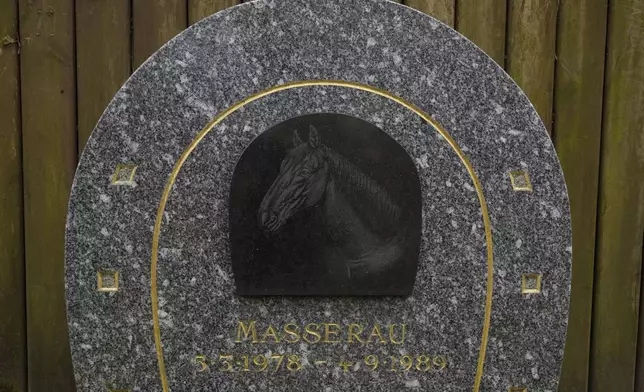 A grave for a horse named "Masserau" is seen at the pet cemetery of Asnieres-sur-Seine, west of Paris, Friday, Feb. 21, 2025. (AP Photo/Michel Euler)