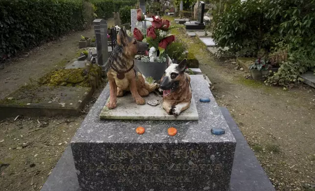 A grave for a dog named "Rintintin" is seen at the pet cemetery of Asnieres-sur-Seine, west of Paris, Friday, Feb. 21, 2025. (AP Photo/Michel Euler)
