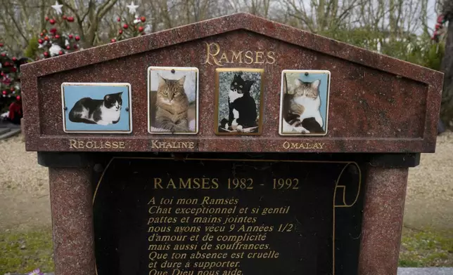 A grave for a cat named "Ramses" is seen at the pet cemetery of Asnieres-sur-Seine, west of Paris, Friday, Feb. 21, 2025. (AP Photo/Michel Euler)
