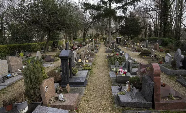 Graves at the pet cemetery of Asnieres-sur-Seine, west of Paris, Friday, Feb. 21, 2025. (AP Photo/Michel Euler)