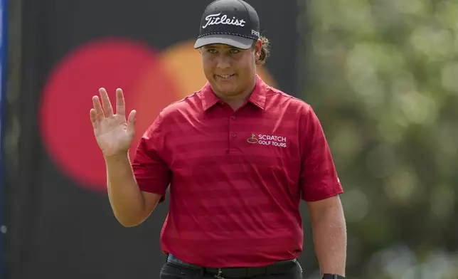 Aldrich Potgieter, of South Africa, reacts to making a birdie on the 13th hole during the second round of the Mexico Open golf tournament in Puerto Vallarta, Mexico, Friday, Feb. 21, 2025. (AP Photo/Fernando Llano)