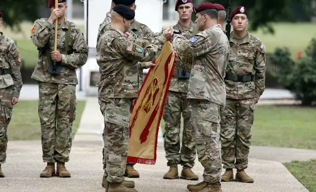 FILE - Lt. Gen. Christopher T. Donahue, front right, takes part of the Casing of the Colors during a renaming ceremony, June 2, 2023, in Fort Liberty, N.C. (AP Photo/Karl B DeBlaker, File)