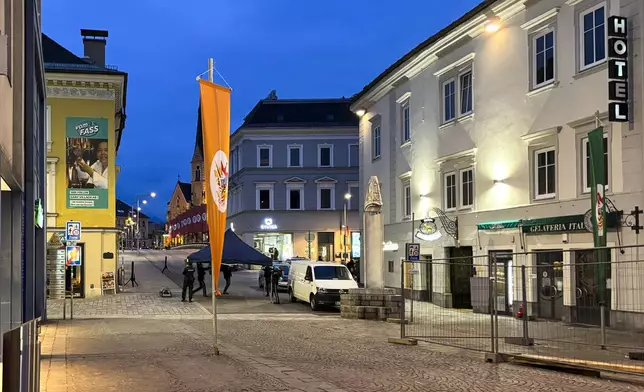 Police officers work at the scene where a 23-year-old man stabbed several people in the southern Austria city of Villach, Saturday, Feb. 15, 2025. (Wiesflecker/Kleine Zeitung via AP)