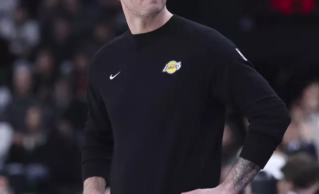 Los Angeles Lakers head coach JJ Redick looks to the bench during the first half of an NBA basketball game against the Utah Jazz, Wednesday, Feb. 12, 2025, in Salt Lake City. (AP Photo/Rob Gray)