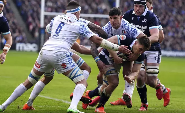 Scotland's Rory Darge scores the opening try during the Six Nations rugby union match between Scotland and Italy, at Murrayfield Stadium, Edinburgh, Scotland, Saturday Feb. 1, 2025. (Andrew Milligan/PA via AP)